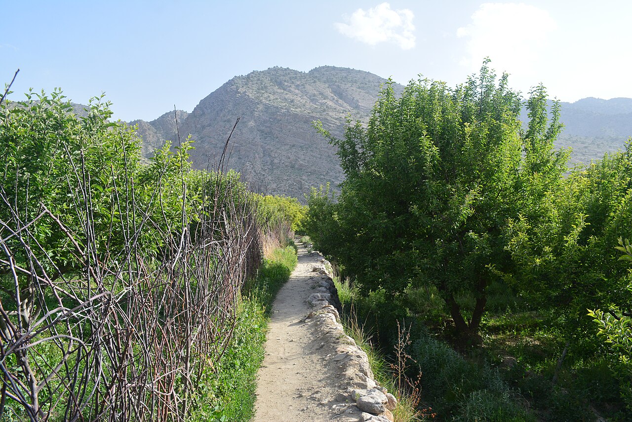 Arid, rocky terrain and a road running through the Balochistan landscape
