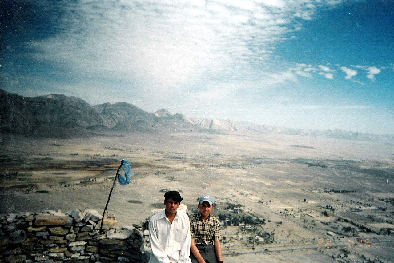 A view of the dry, mountainous landscape around Khuzdar in Balochistan under a clear sky.