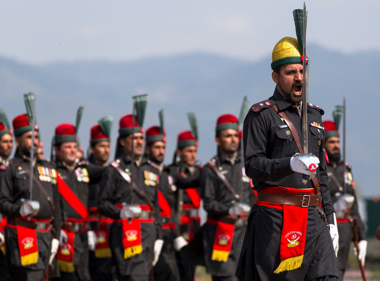 A marching contingent of Pakistan's Frontier Corps paramilitary force in ceremonial formation.