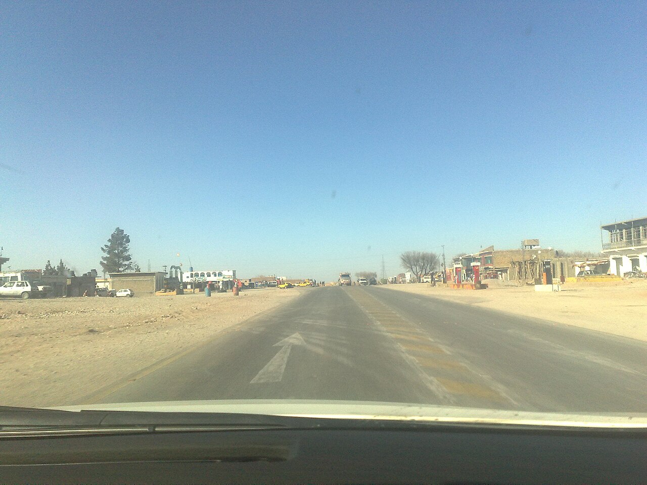 The N-25 highway running through Surab in Balochistan, with dry hills in the background.