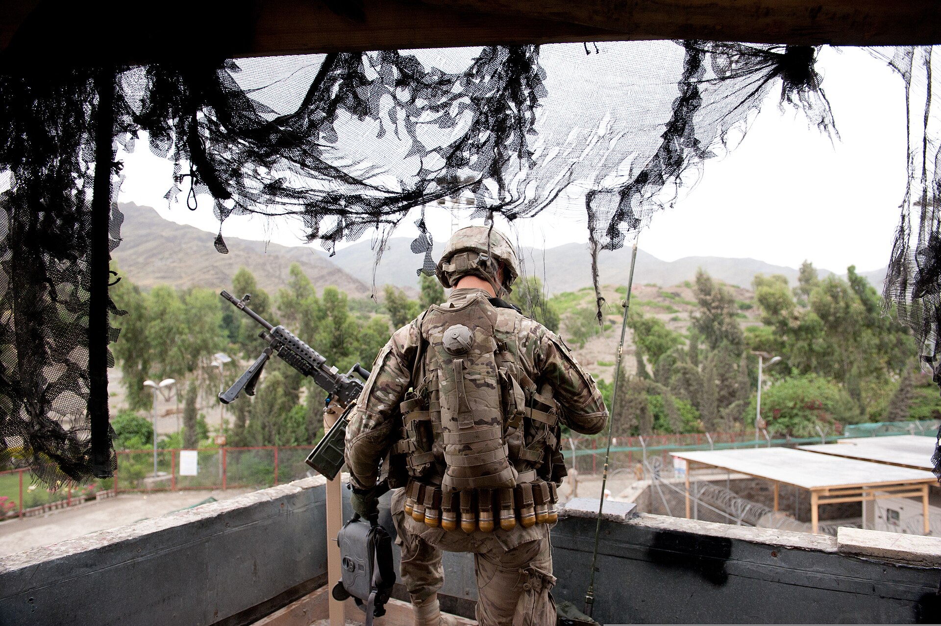 A soldier providing rooftop security at the Torkham border crossing on the Pakistan-Afghanistan border.