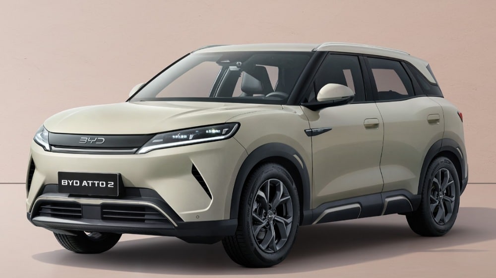 A beige BYD Atto 2 electric SUV photographed from the front three-quarter angle with a BYD ATTO 2 number plate.