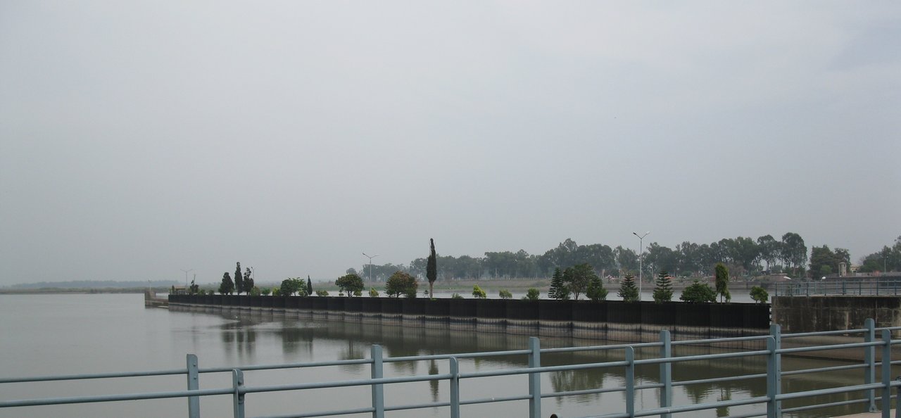 The Marala Headworks on the Chenab River in Punjab, Pakistan, seen from above with barrage gates and a road bridge.