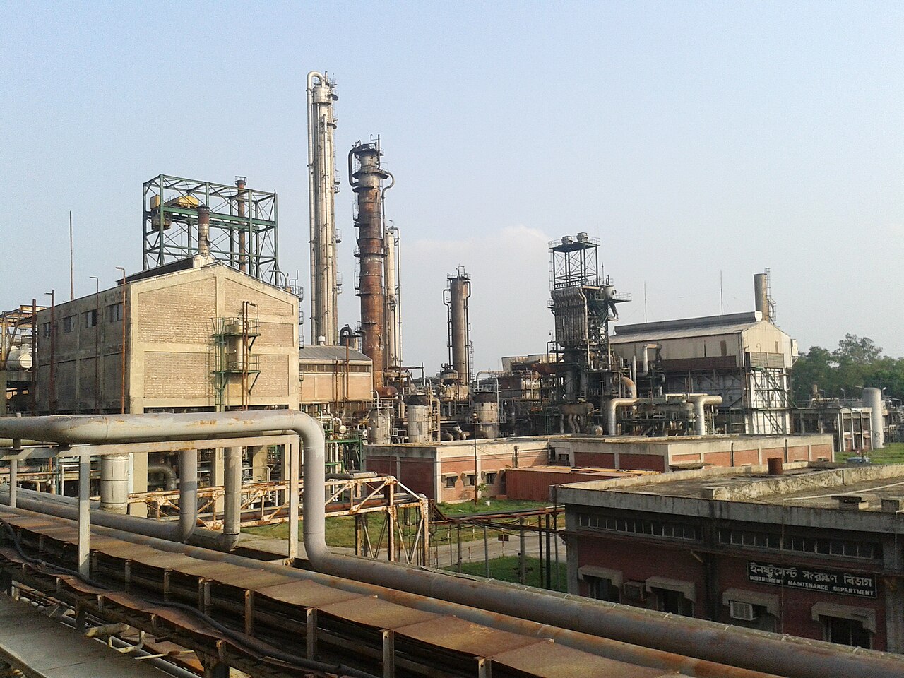Metal towers, pipes and reactors at a large urea fertilizer production plant.