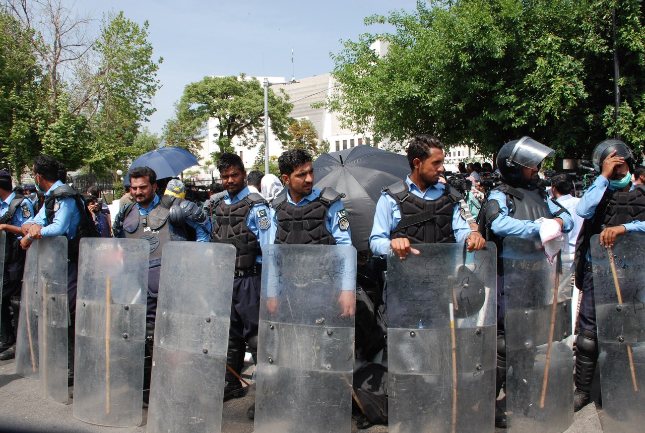 Police officers in uniform standing near the Supreme Court building in Islamabad