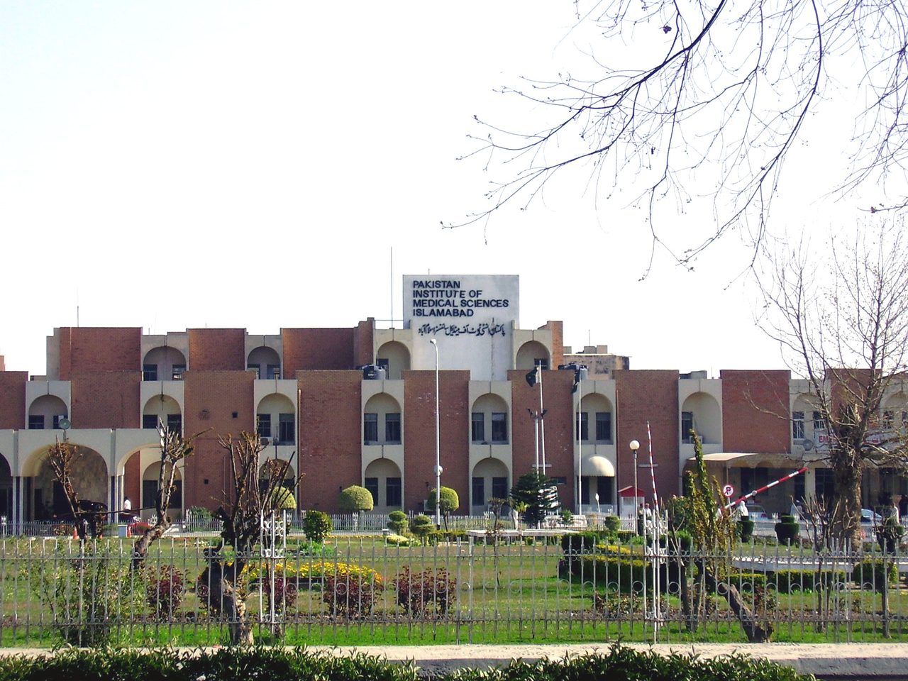 The red-brick facade of the Pakistan Institute of Medical Sciences in Islamabad.