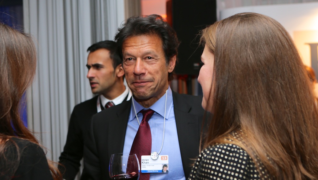 Imran Khan, wearing a dark jacket, speaks at a public event in a file photograph from 2013.