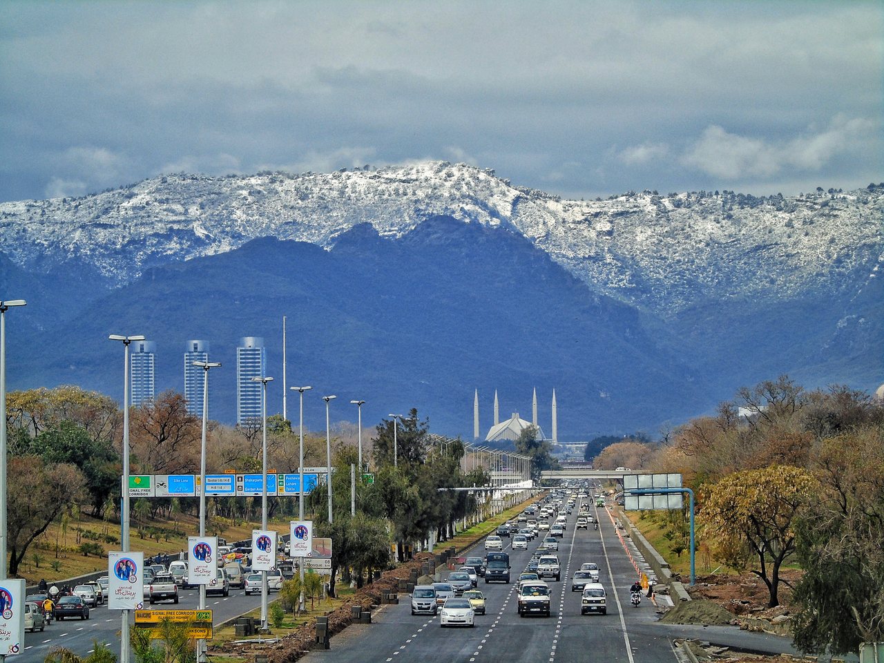 Faisal Mosque in Islamabad, a large white modern mosque with sloping roofs and tall minarets