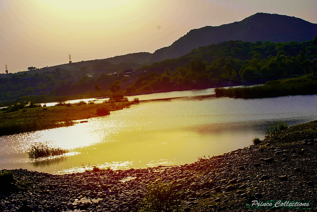 Sunset view of the Ghazi-Barotha Dam and reservoir on the Indus River