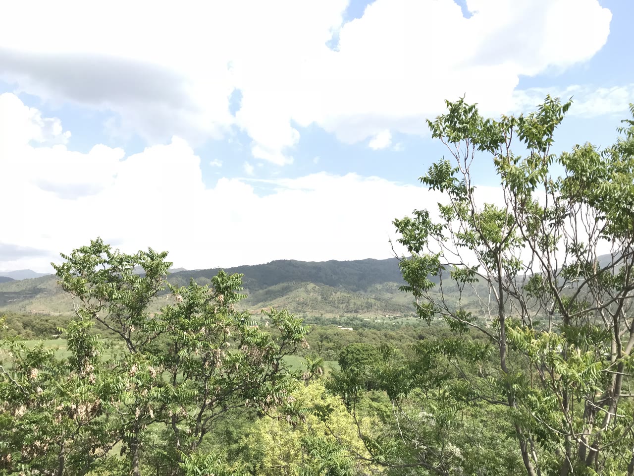 A green mountainous landscape with a river valley in Lower Dir district, Khyber Pakhtunkhwa.