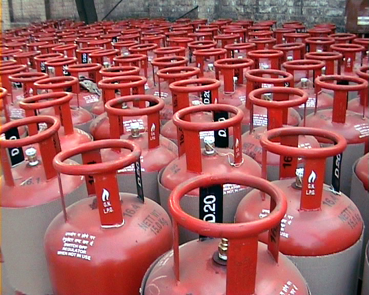 Rows of red refillable liquefied petroleum gas cylinders.
