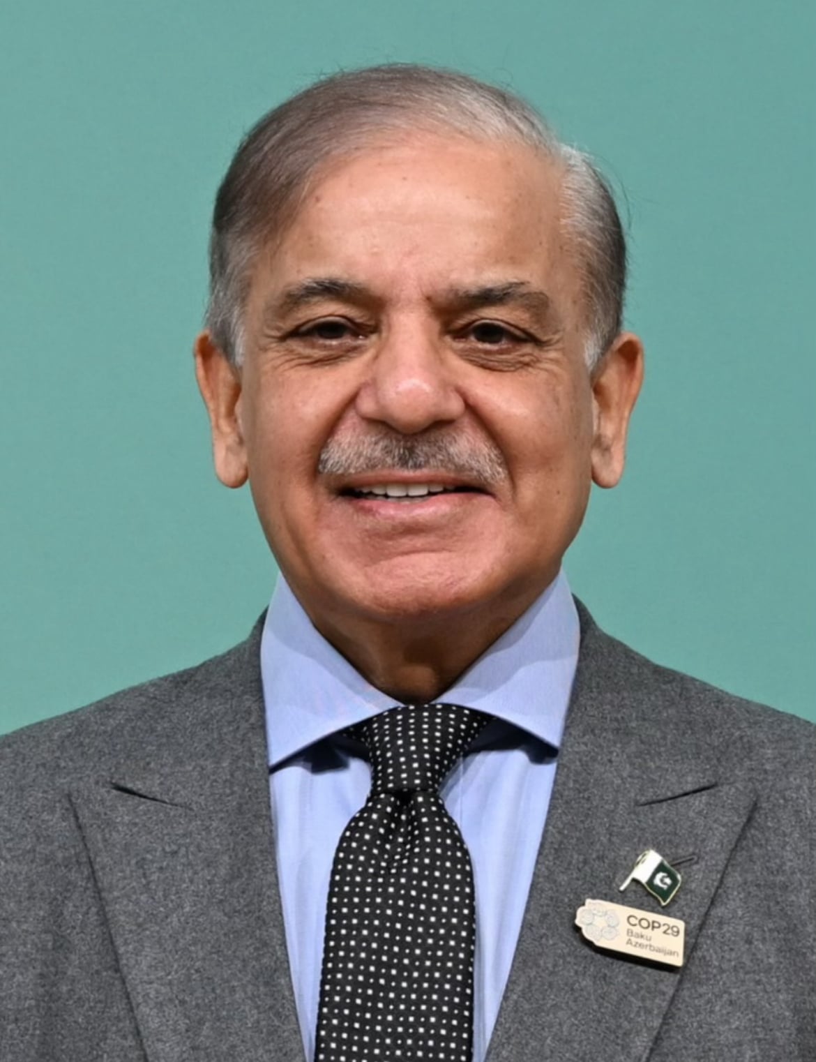 Prime Minister Shehbaz Sharif in a dark suit during an official engagement.