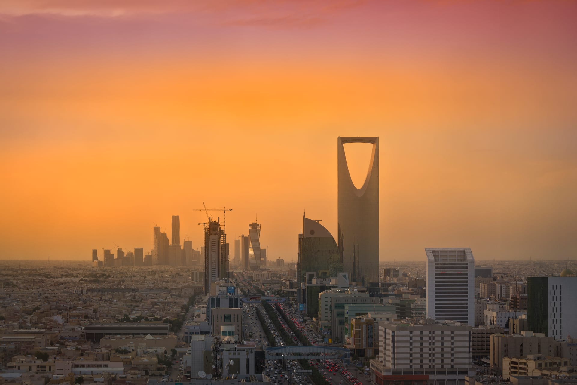 The Riyadh skyline with the Kingdom Centre tower and the towers of the King Abdullah Financial District rising above the city.