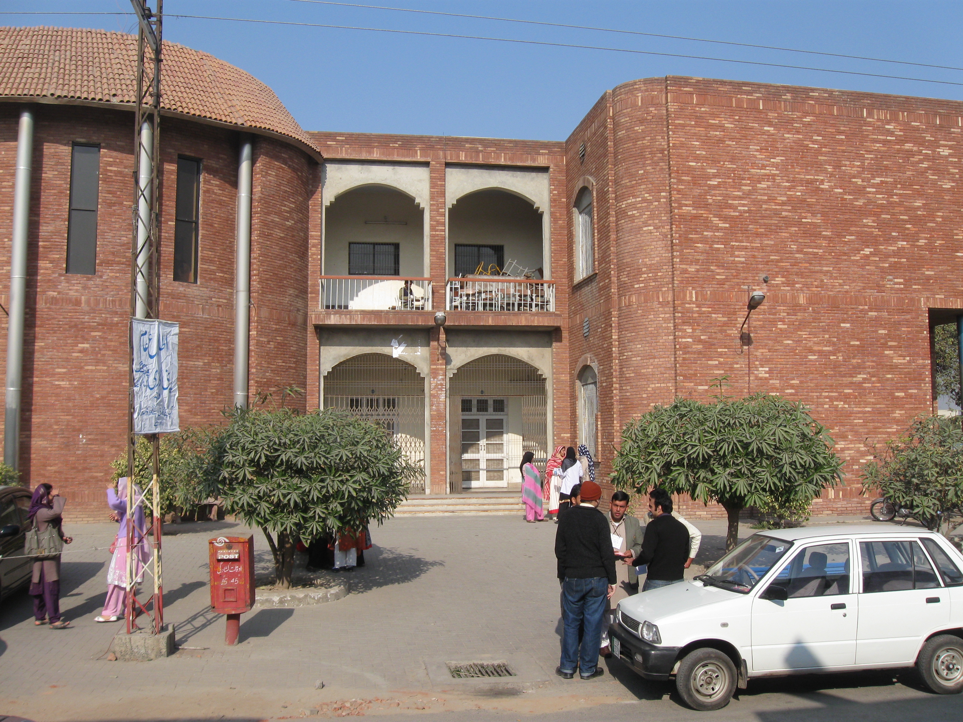 An examination hall at Punjab Medical College, Faisalabad, with rows of desks