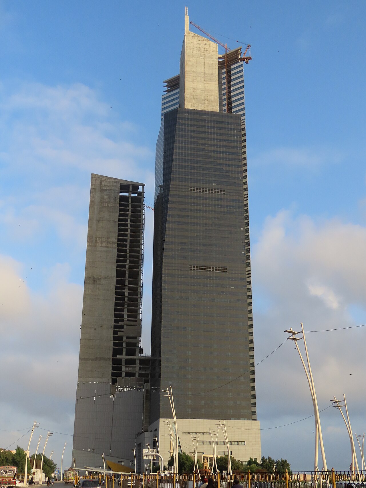 The Bahria Icon Tower, a tall modern skyscraper in Karachi, seen from below.
