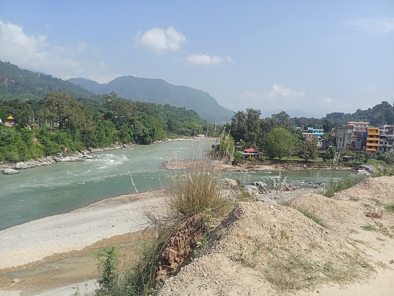 The rivers and riverside buildings at Devighat in 2020, before the August 2026 floods