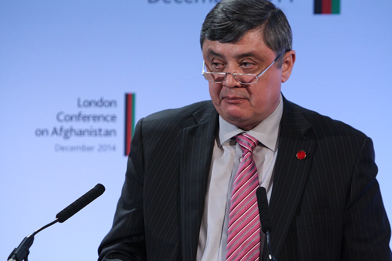 Russia's Special Presidential Envoy for Afghanistan Zamir Kabulov speaks into a microphone at a conference panel