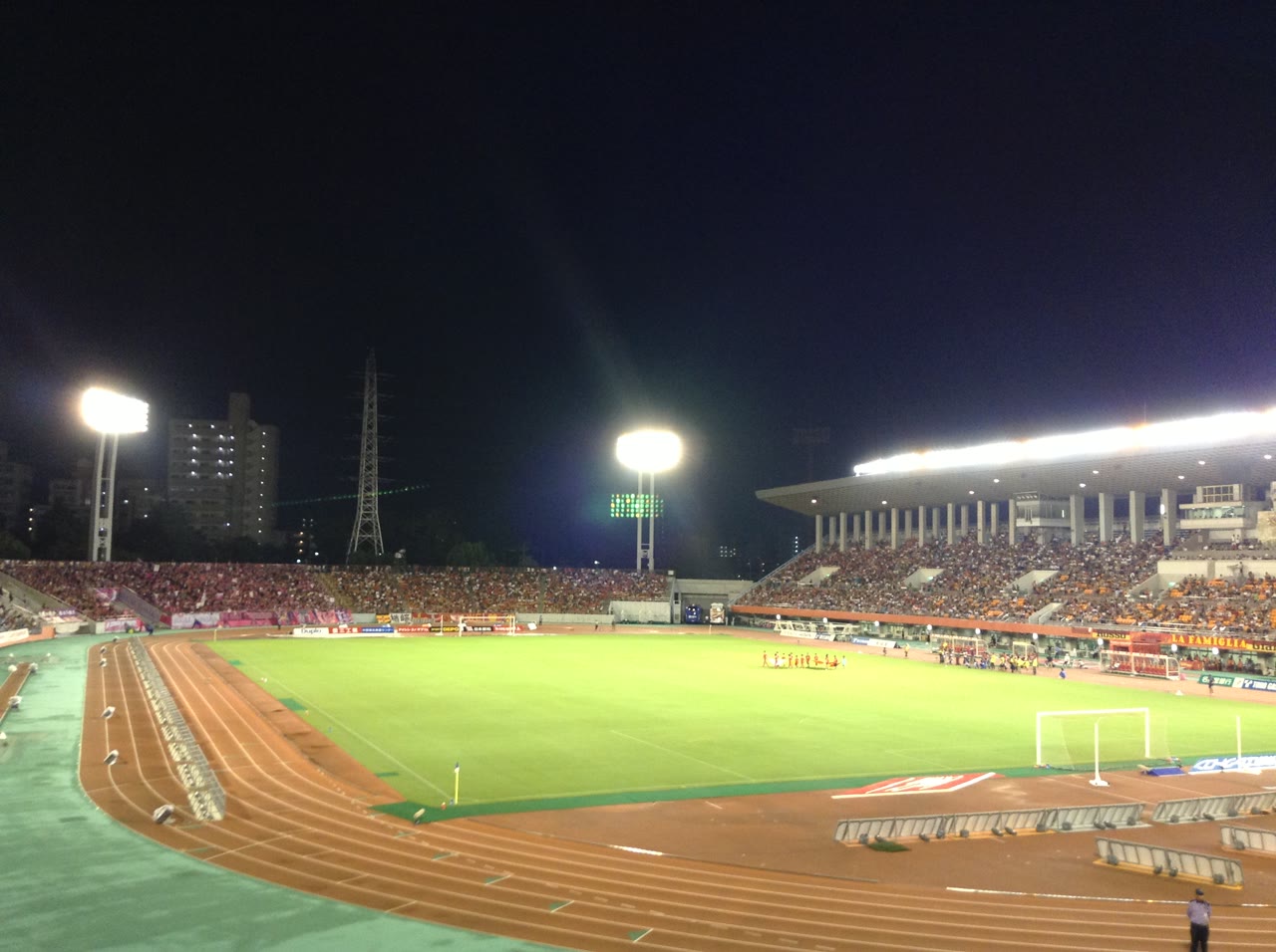 Floodlit stands and playing field of the Mizuho Park Athletic Stadium in Nagoya