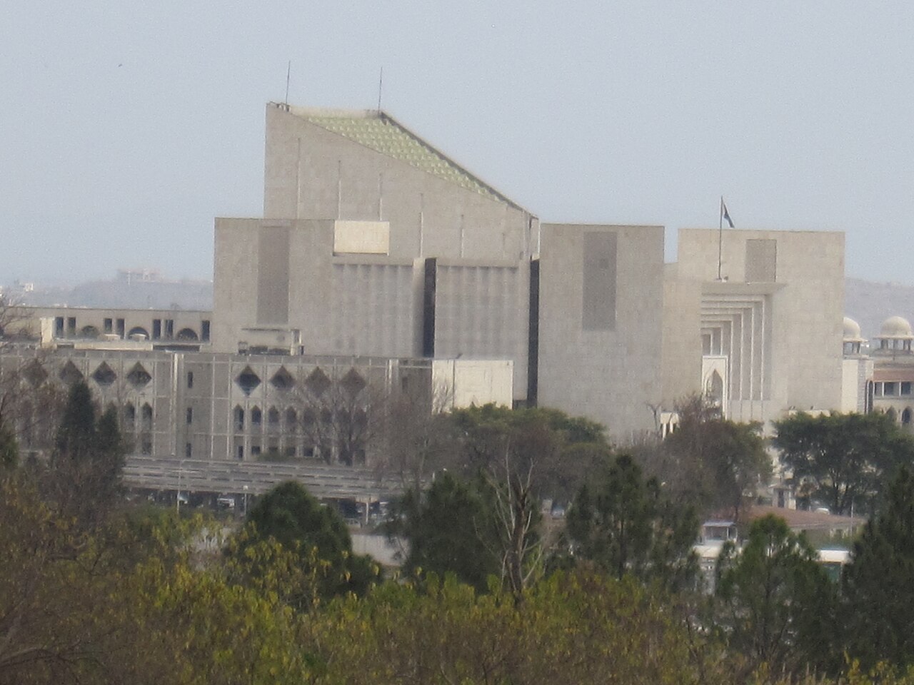 Exterior view of the Supreme Court of Pakistan building in Islamabad, photographed from the surrounding government flats.