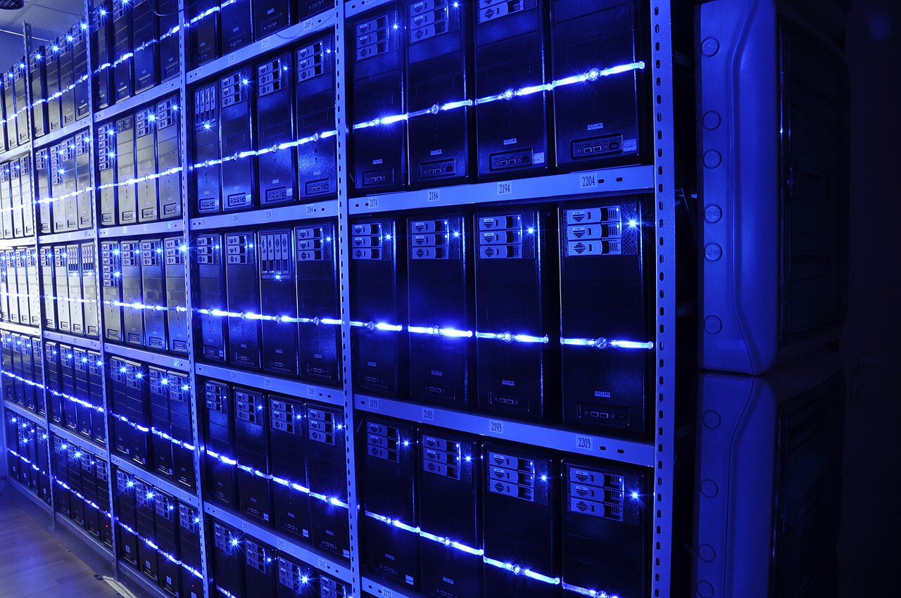 Rows of server racks and cabling inside a data centre