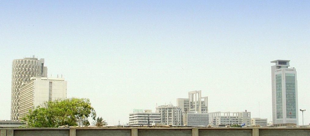 Daytime view of Karachi's I. I. Chundrigar Road skyline, showing the MCB Tower on the right and the Habib Bank Plaza on the left
