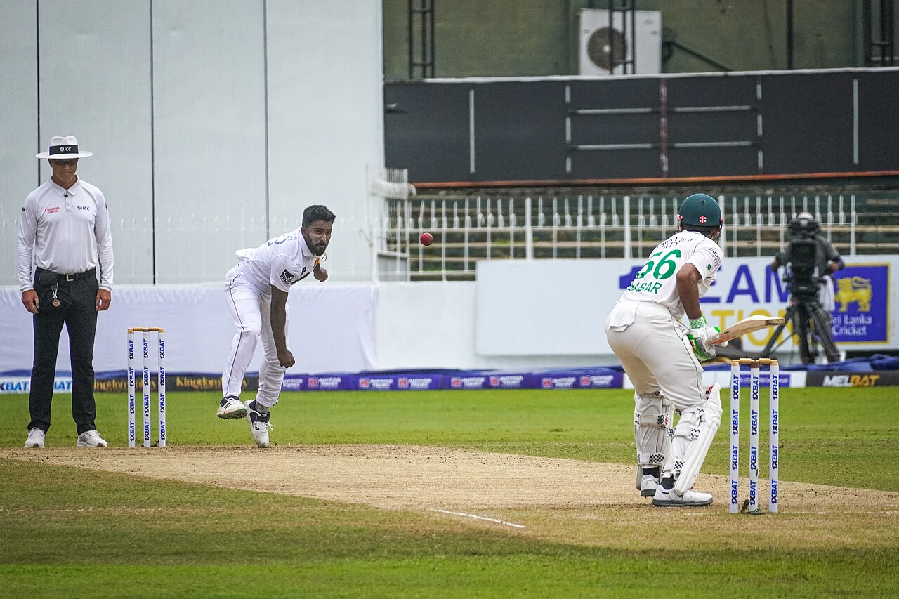 Pakistan batter Babar Azam watches a red ball as Sri Lanka fast bowler Asitha Fernando completes his delivery