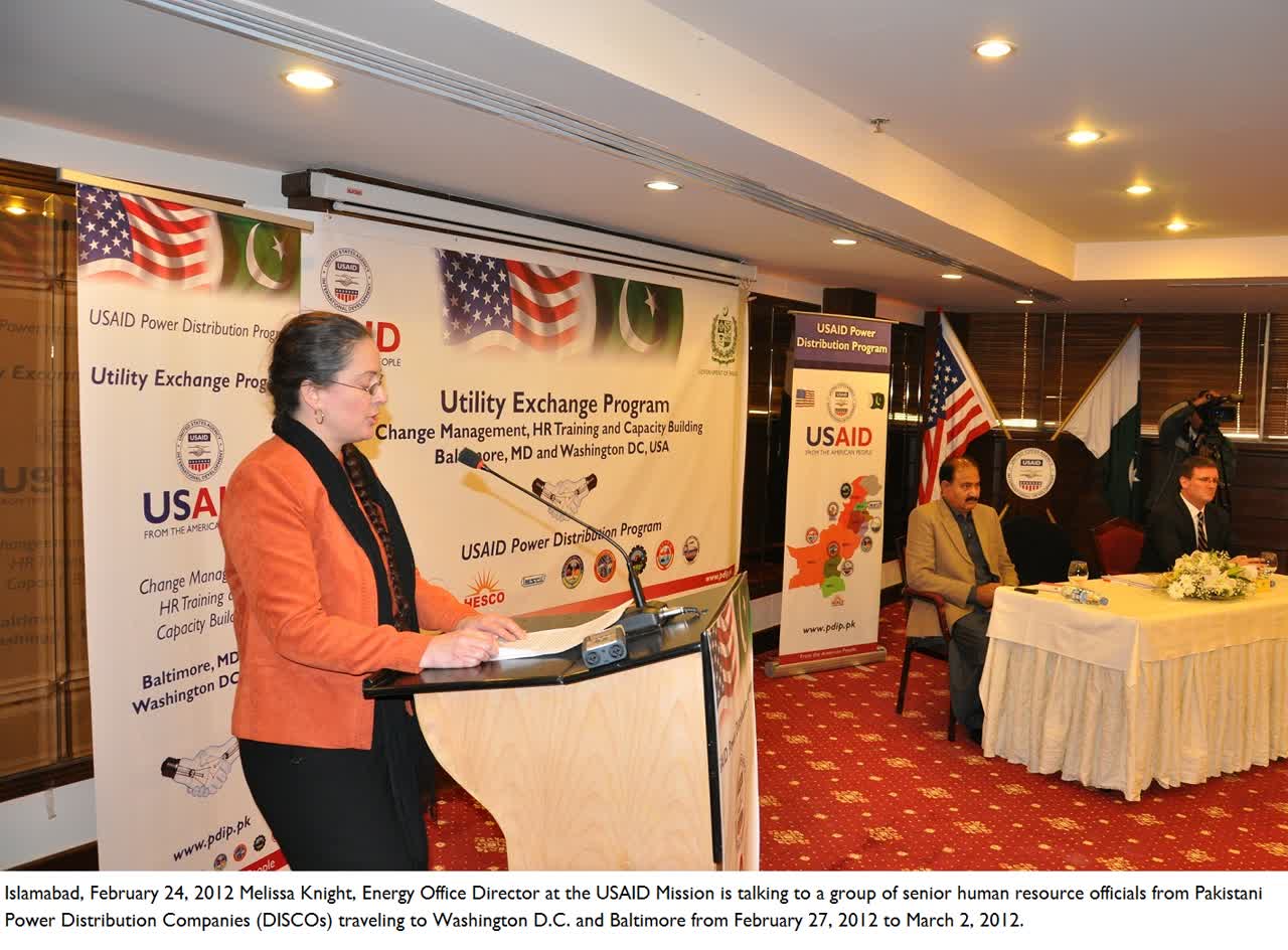 An archival 2012 group photograph of Pakistani power distribution company officials at an exchange programme event in Islamabad, used as contextual imagery of the DISCO sector being privatised; the photo does not depict the 4 October 2026 Privatisation Commission briefing.