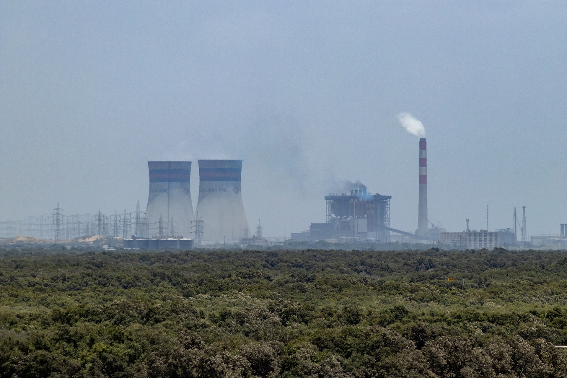 Coal-fired power plant with cooling towers and electricity pylons at Port Qasim, near Karachi