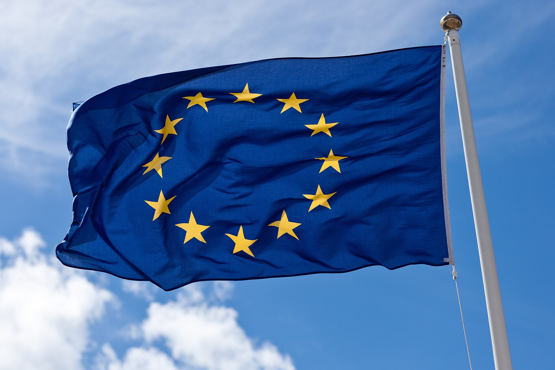 European Union flag flying against a blue sky