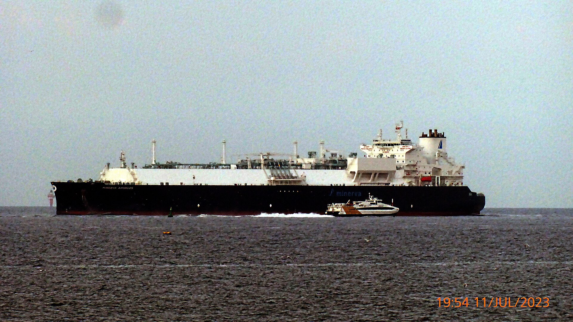 A large liquefied natural gas carrier at sea with its cargo containment system visible above deck.