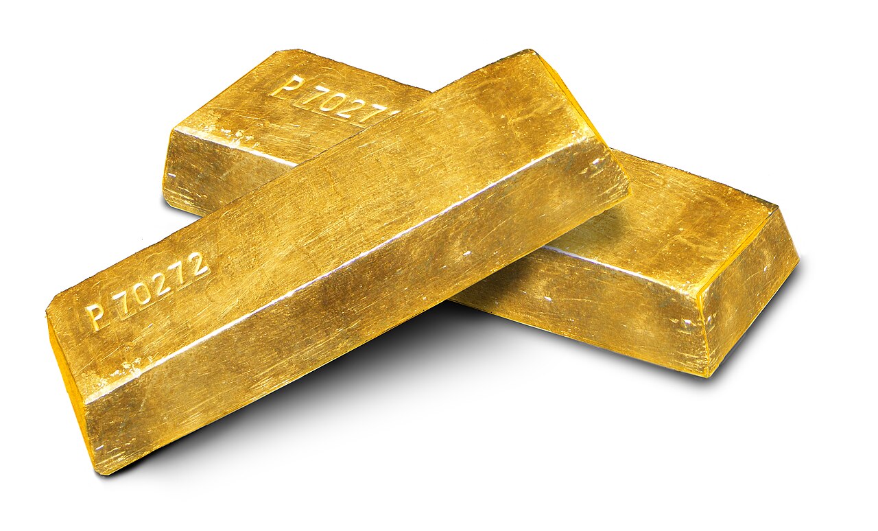 Several gold ingots arranged on a plain white background