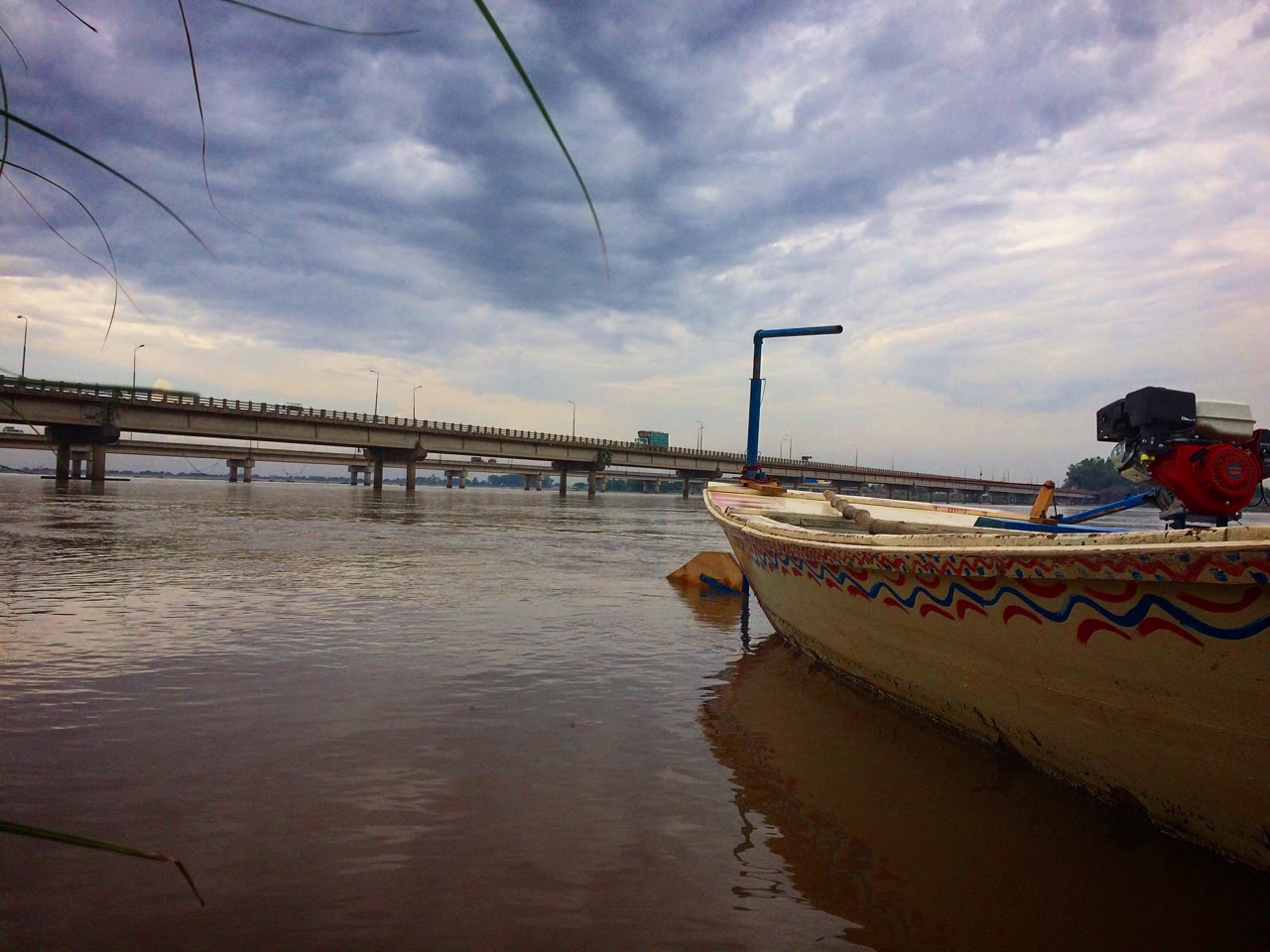 The Chenab River flowing past farmland near Gujrat in Punjab, Pakistan.