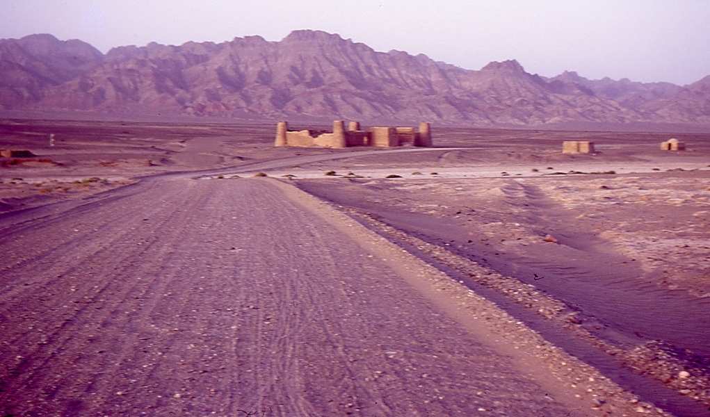 A dirt track running across arid terrain at the Iran-Pakistan border between Mirjaveh and Taftan.