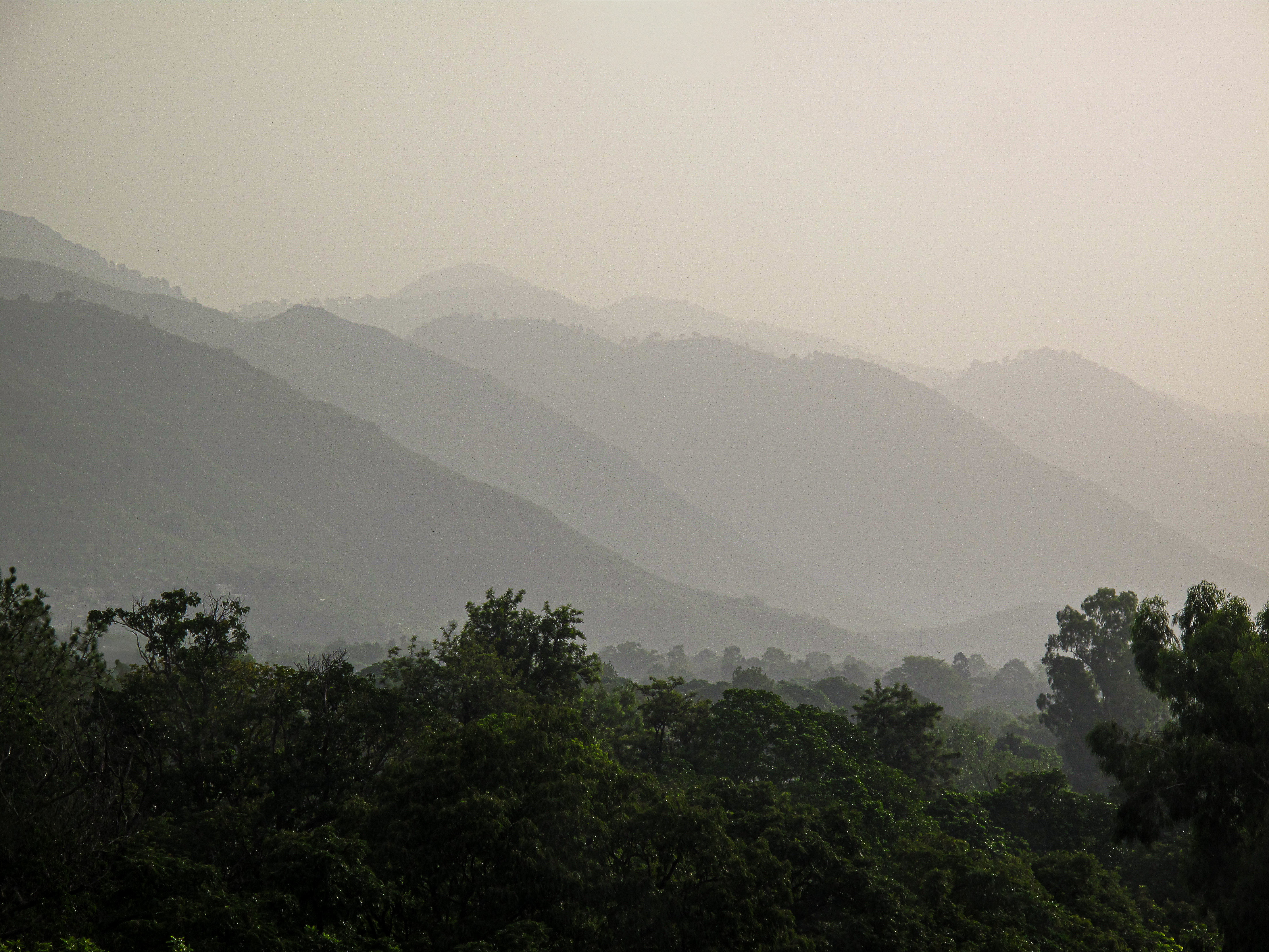 Monsoon clouds and rain over the Margalla Hills near Islamabad.