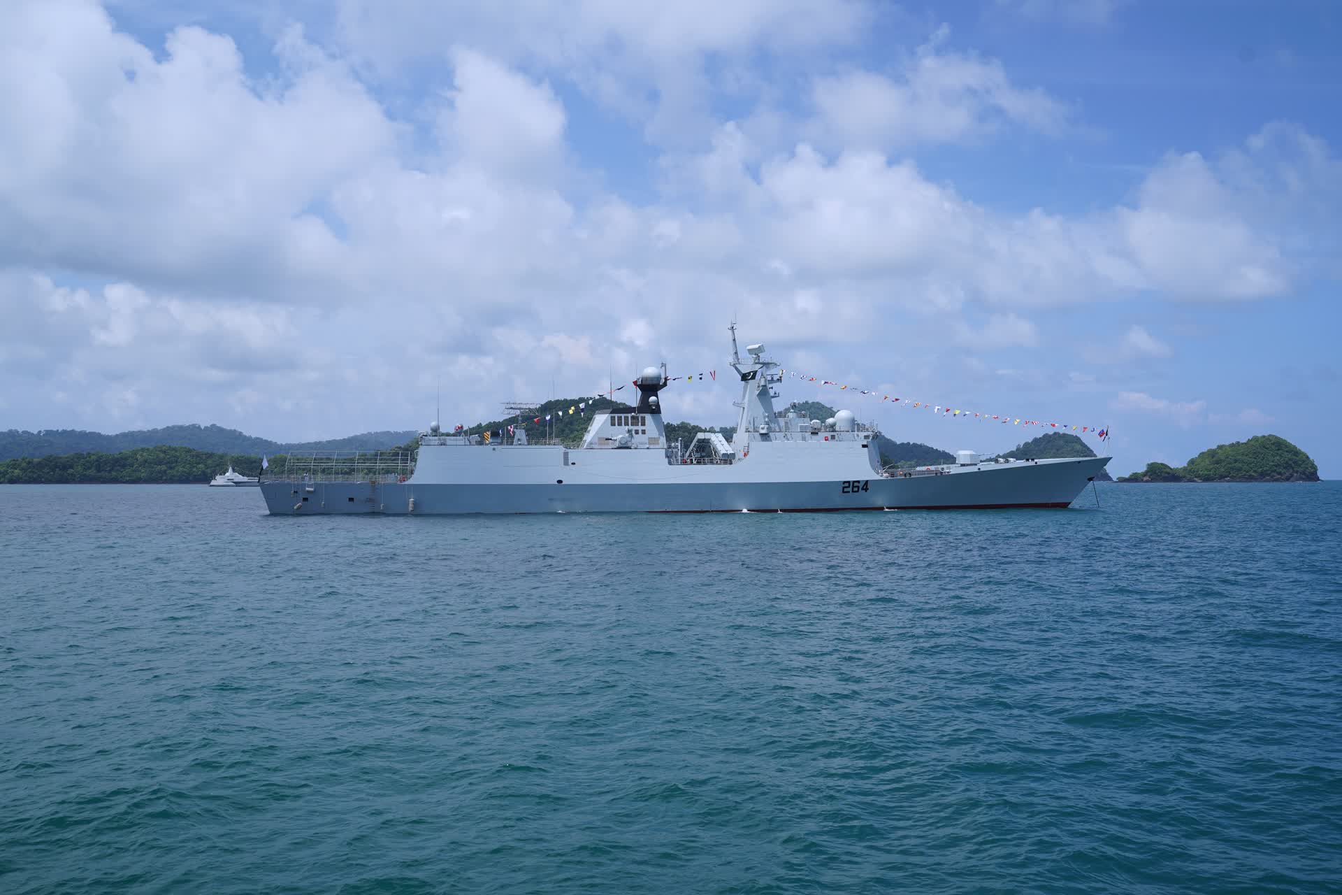 A grey Type 054A/P Tughril-class guided-missile frigate of the Pakistan Navy underway at sea, viewed from a low angle on the starboard bow, with the sloped hull and integrated mast visible against open water