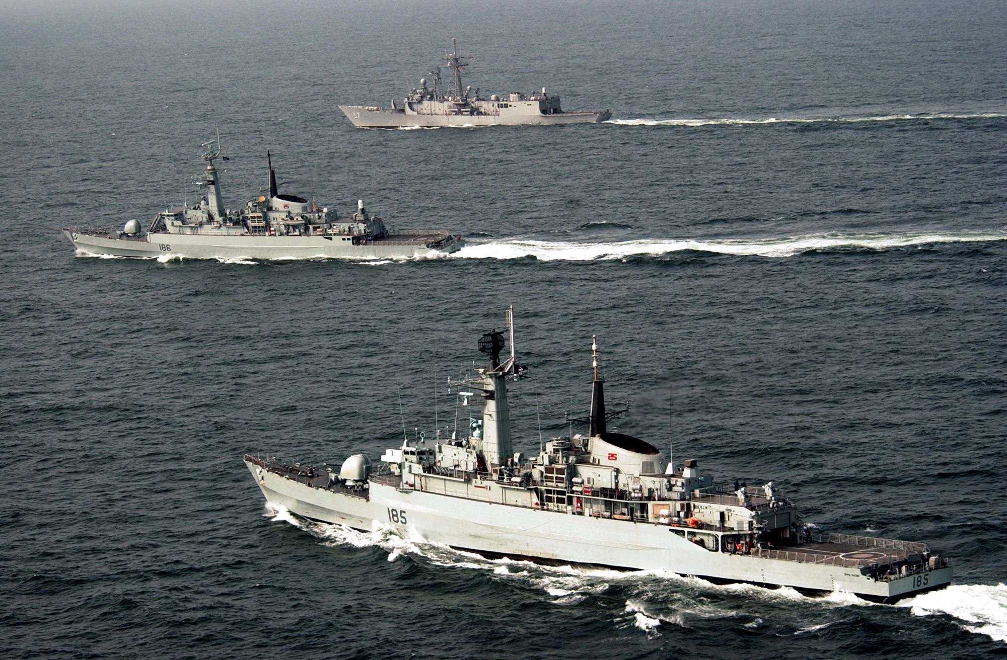 Two Pakistan Navy warships underway together in the Arabian Sea, seen from the air.