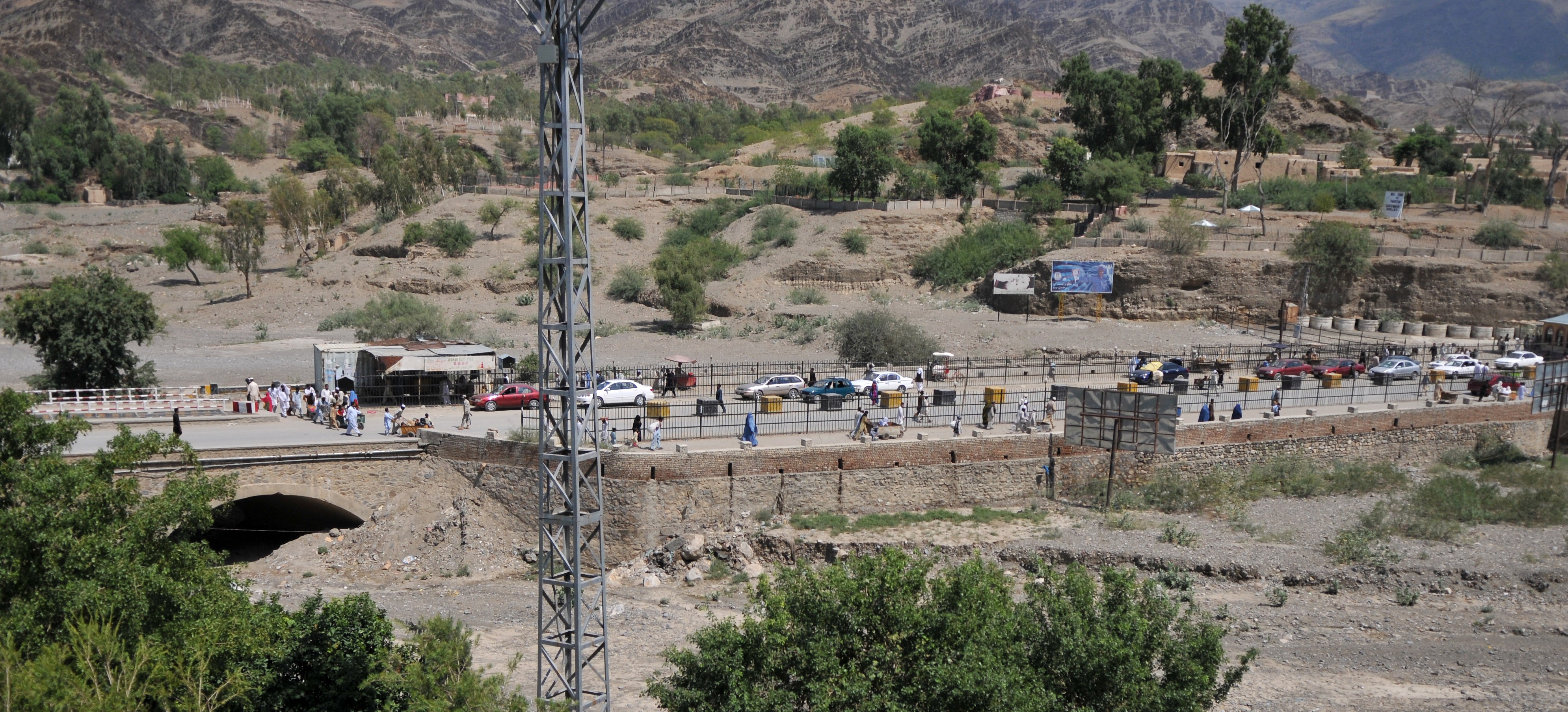 A line of trucks and vehicles waiting at the Torkham border crossing between Afghanistan and Pakistan.
