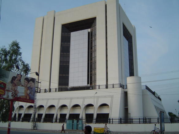 Archival July 2003 photograph of the State Bank of Pakistan's Multan branch building; contextual image for a story about the federal government and central bank reporting different SOE-debt numbers, it does not depict any current event.