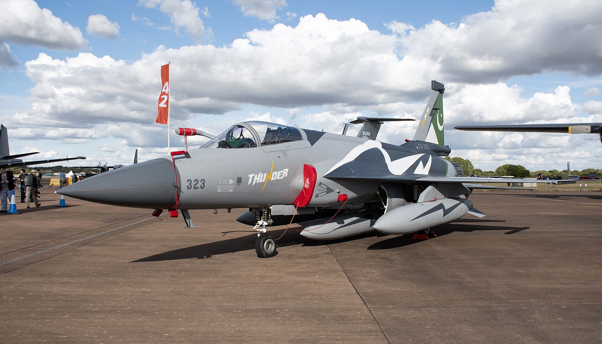 A Pakistan Air Force JF-17 Thunder fighter jet parked on an airfield ramp