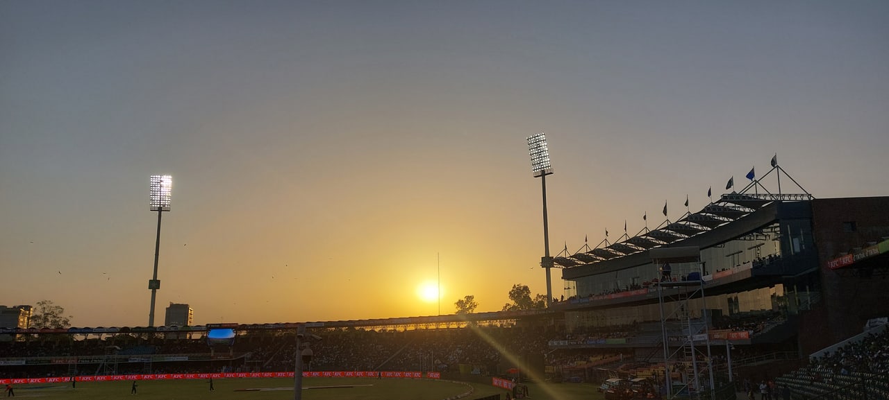 A floodlit cricket match in progress at Gaddafi Stadium in Lahore, Pakistan, in 2022.