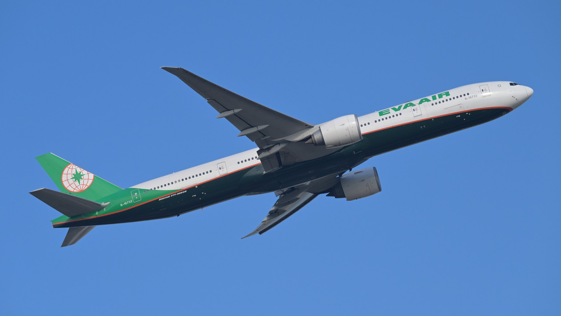 An EVA Air Boeing 777-300ER in green and white livery climbing away against a clear blue sky, seen from below with its wings swept back.