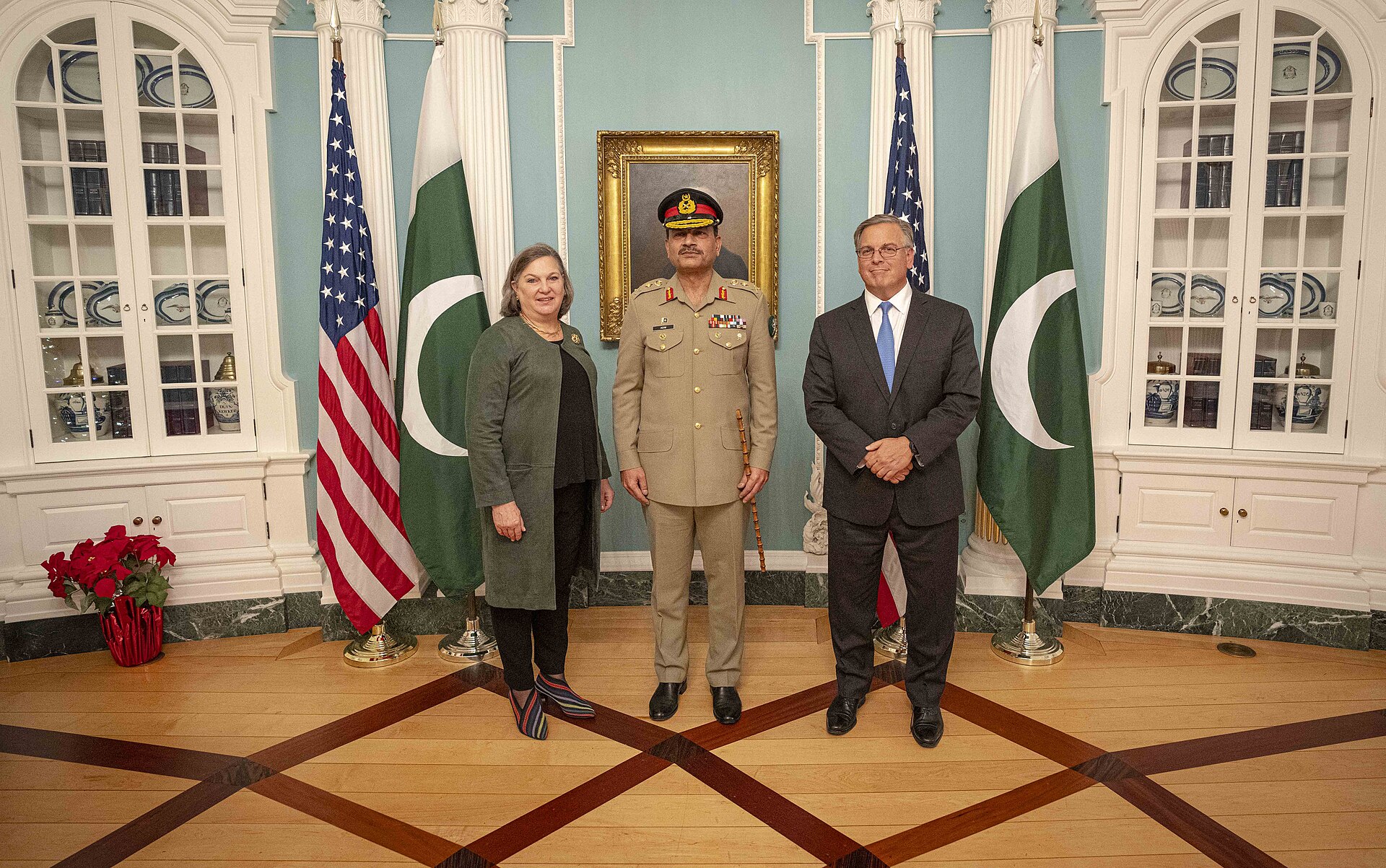US and Pakistani officials seated along a long table during a meeting at the US State Department.