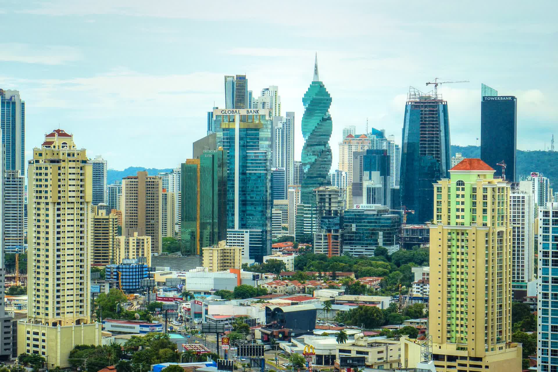 A dense cluster of high-rise towers forming the Panama City skyline, photographed in daylight from a nearby vantage point.