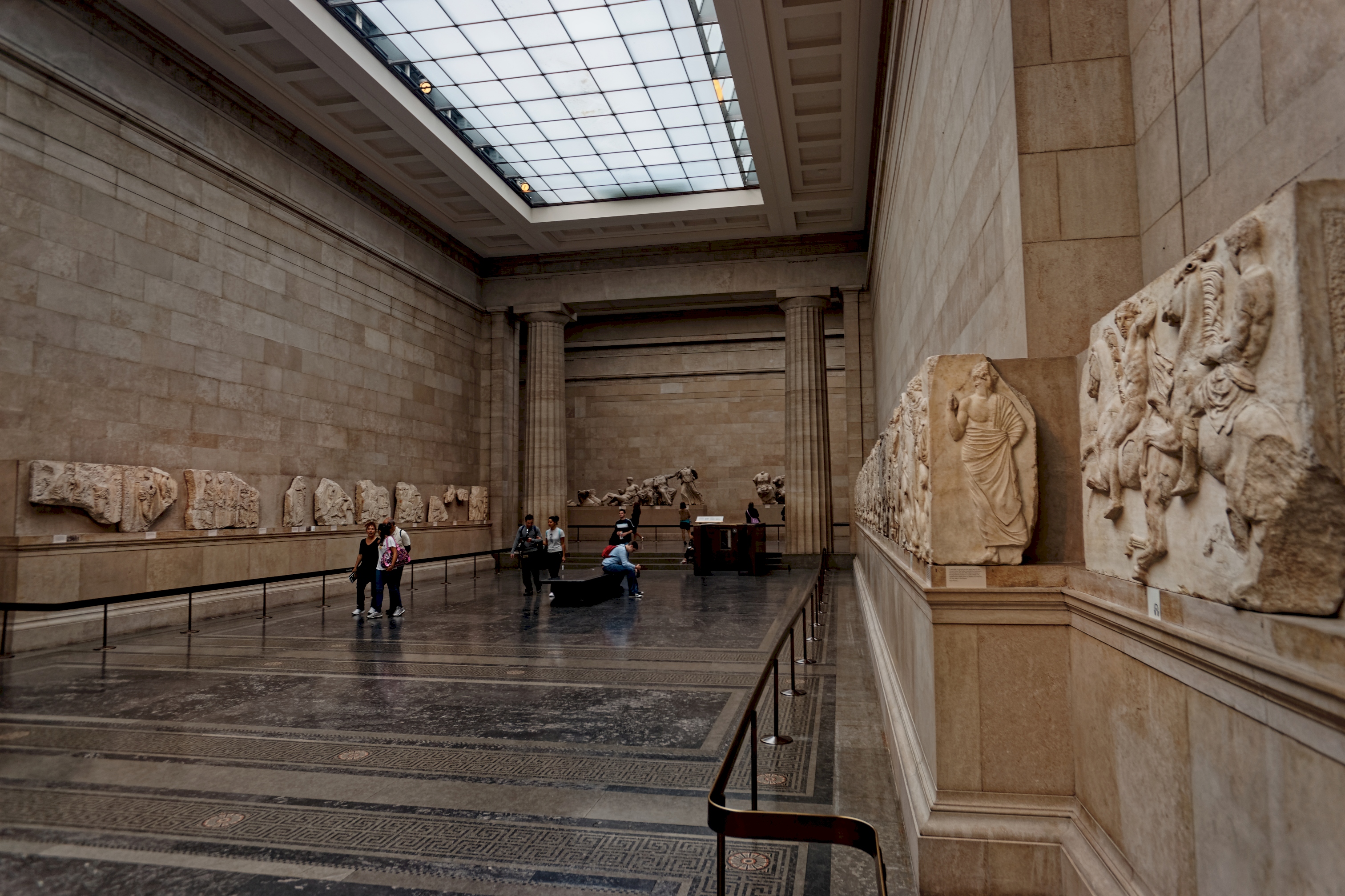 Parthenon marble relief sculptures mounted along the wall of the Duveen Gallery at the British Museum