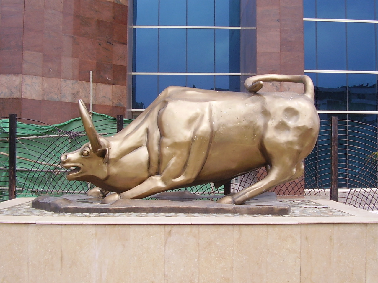 A bull statue in front of a stock exchange building in Pakistan.