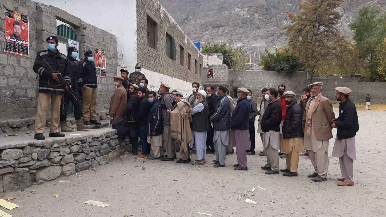 Voters queuing outside a polling station during a Gilgit-Baltistan Assembly election.