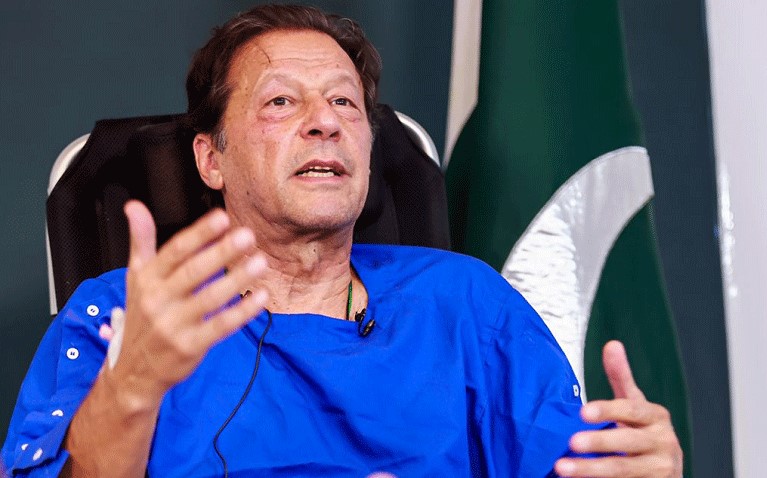 Former Pakistani prime minister and PTI founder Imran Khan gestures while speaking, in a file photograph.