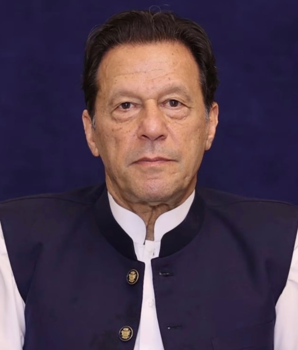Imran Khan, founder of Pakistan Tehreek-e-Insaf, in a dark jacket, photographed against a plain background.