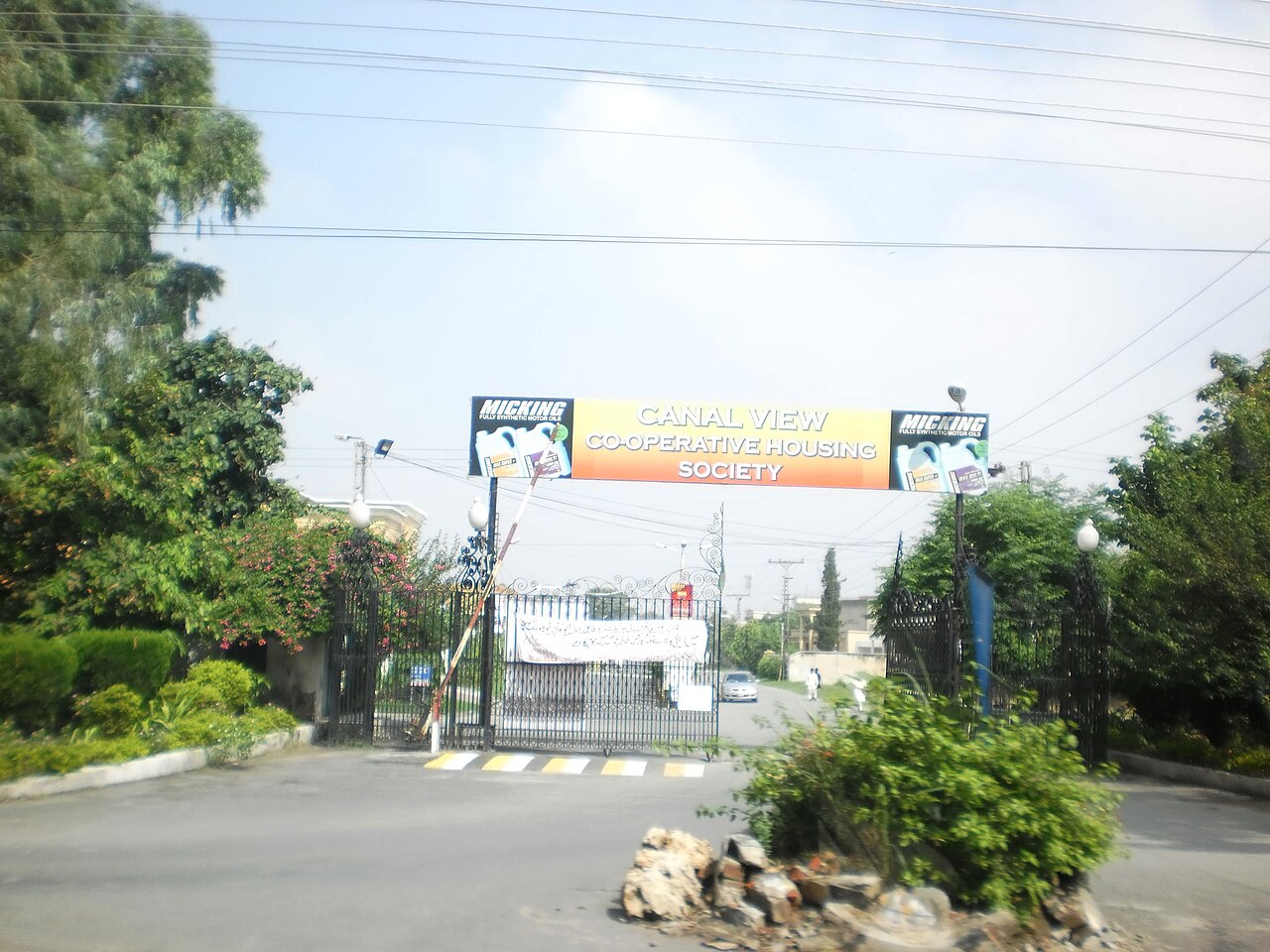 A view of a housing society in Lahore, Punjab, showing residential plots, buildings and a road