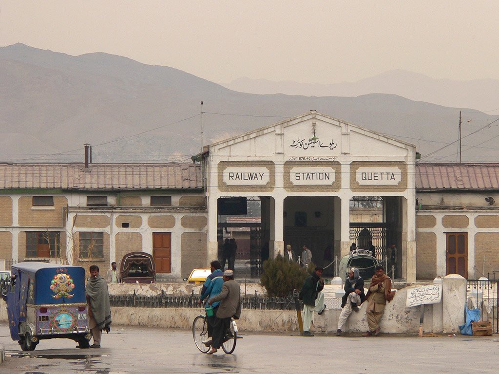 A view of Quetta Railway Station in Balochistan, with a train standing at the platform.